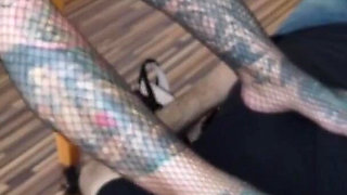 Blonde tattooed lady and her foot slave
