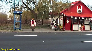 Nylon woman peeing on street