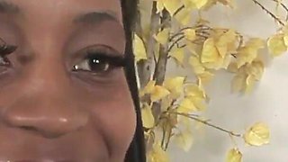 Ebony girl with natural tits gives a blowjob to a black cock that cums in her mouth