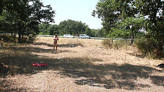 The Littl Tih Girl Shows off Her Tits to the Cars