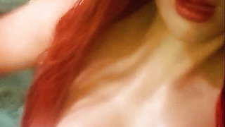 Redhead tranny mask in Jacuzzi