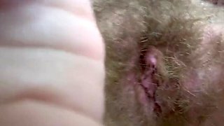 Cute Amateur Blonde Smoking Cigar and Showing Hairy Bush Close Up