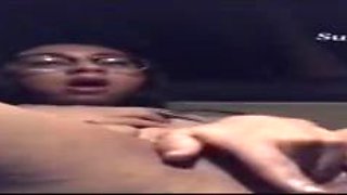 Wild dame with glasses is caressing and frigging her moist cooter in the back of a van