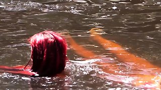 Hot red haired hitchhiker has lesbian sex in nature