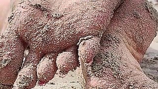 Covered in Sand and Above It All