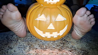 Showing off our soles next to the pumpkin