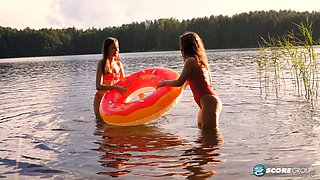 Margo Von Teese and Simona splash each other in their bikinis on the beach before eating each other out on the lake