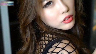 Pretty chinese model in fishnet