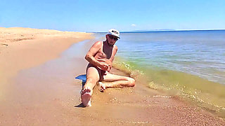 Nudist Couple Having Pegging Session on the Beach