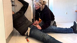 Blonde MILF Gives Plumber a Blowjob in the Kitchen