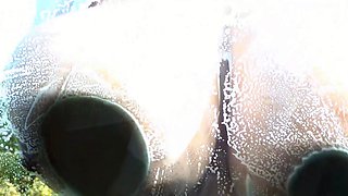 Blonde is flashing her big boobs in the outdoors