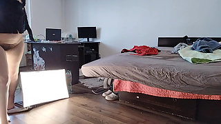 An amateur woman has fun trying on clothes and cutting them. An amateur married woman dances naked in the house.