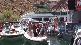 Naughty girls gets fucked outside during a huge lake party.
