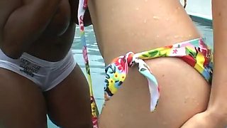 Two hot girls licking in the pool