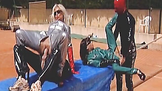 Latex German bitches assfucked and fisted in the foursome on the tennis court