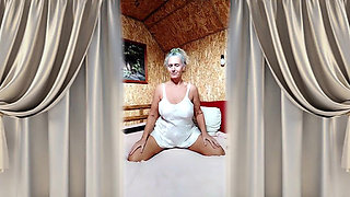 Hot Housewife Lukerya in Satin White Lingerie on a Large Soft Bed