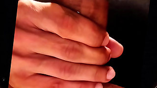 She massages my cock with her toes that are covered in my cum.