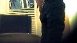 Girl using the toilet and filmed by voyeur 1