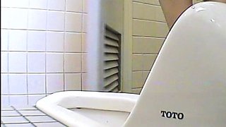 Cute amateur asian web cam girl playing with her toy