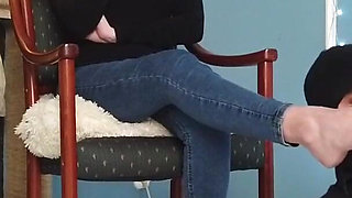 Worshiping the feet of a girl in blue jeans