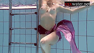 Sexy Russian redhead smoking by the pool