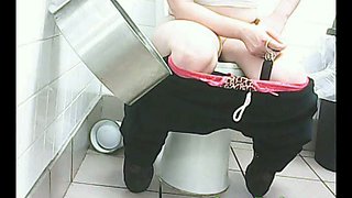 Chunky white amateur woman filmed from front in the toilet