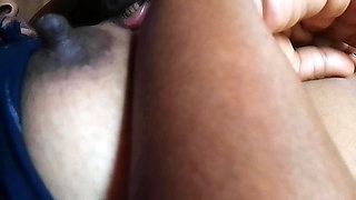 Husband and wife massage her breasts at home