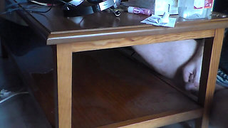 John is pissing on the table shelf