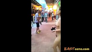 Asian woman stripped naked on street