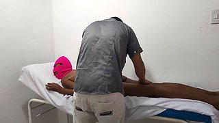 The medic gives his hot brunette patient a stress-relieving massage