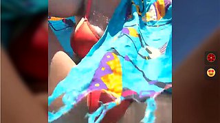 Alimela play pussy in a orange bikini on beach