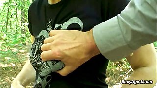 Hairy pussy granny fucks in the woods
