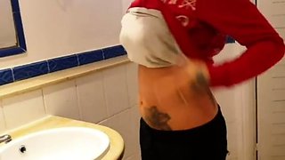 Tattooed milf fucks wild sexy cat in the toilet