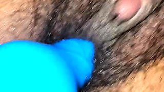 Ebony chick fingering her hairy pussy