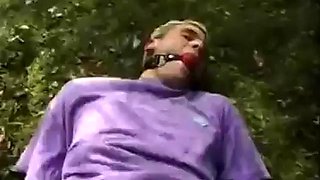 Man dominated by a woman in grove