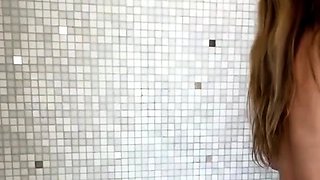 Hot babe with perfect big boobs taking shower