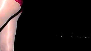 Anna in white shiny pantyhose on the night beach