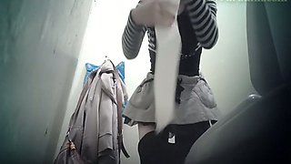 White chick in the public toilet room filmed from behind