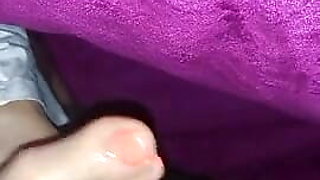 Secret footjob under blanket to