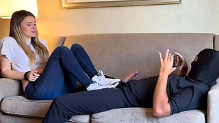 Foot mistress edging masked slave's cock in femdom session