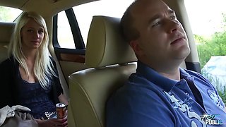 Girl leans out car window to suck cock