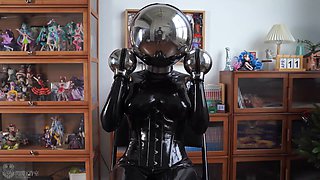 Girl In Latex And Metal And Chastity Belt With Vibrator