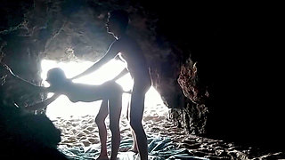 Couple recorded at the beach, inside the cave