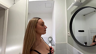 Amazingly beautiful college girl in the bathroom with a super skirt miniskirt shows her ass