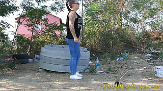 Pee standing on a dirt road in the countryside - Wet her panties outdoor and smoke until they dry