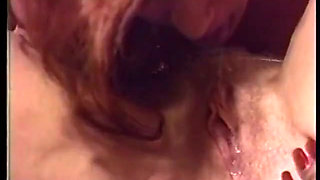 Blonde and redhead lesbians are fucking on a table with a toy