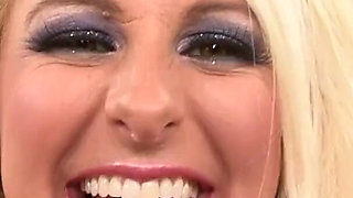 Busty blonde Emilianna gets oil poured into her pussy