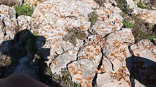 Hot MILF on public beach jerking big cock and fingering pussy