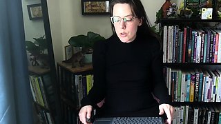 Small titted brunette Sharron with glasses masturbates