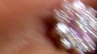 Oiled Brunette Spreads Wide and Pounds Her Pussy with a Thick Dildo